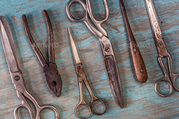 Collection of vintage tools on a blue wooden background - Stock Photo - Images