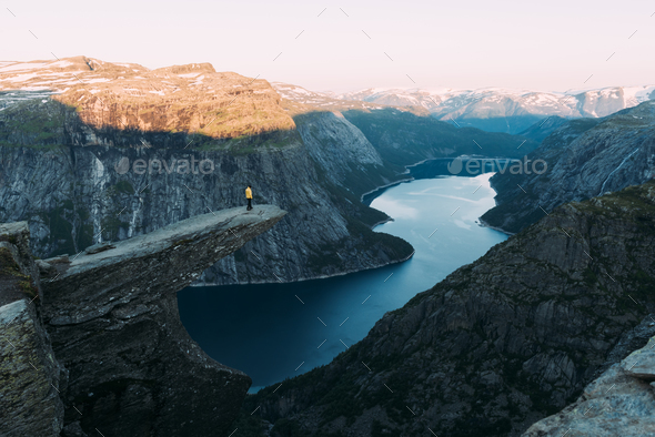 Alone tourist on Trolltunga rock - Stock Photo - Images