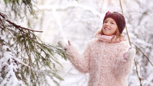 Snowfall in the Forest The Girl Puts Her Face Under the Falling Snowflakes alt
