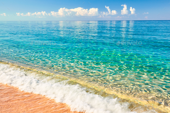 Sea view from tropical beach with sunny sky - Stock Photo - Images