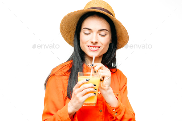 Woman drinks fresh juice fruit, white background - Stock Photo - Images