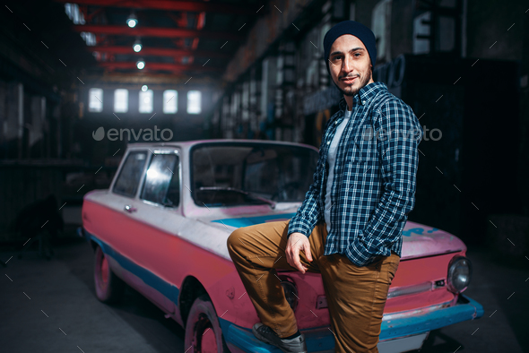 Stalker, traveler pose against USSR retro car - Stock Photo - Images