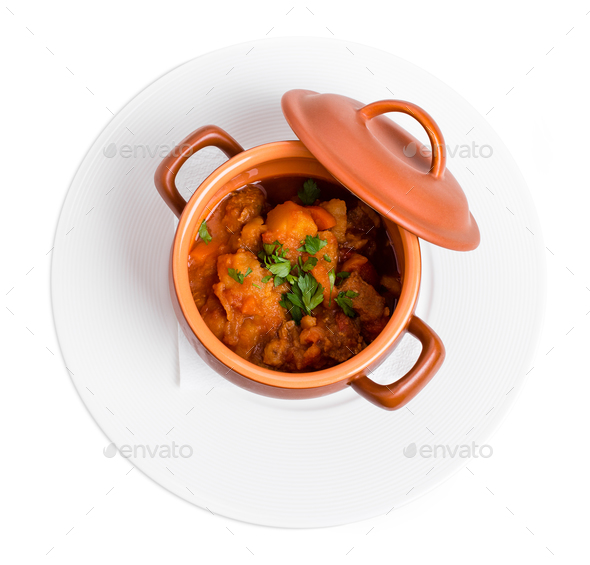 Stewed pork and potatoes in crock pot. Stock Photo by indigolotos