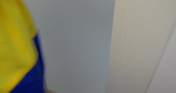 Woman entering by the door and going downstairs alt