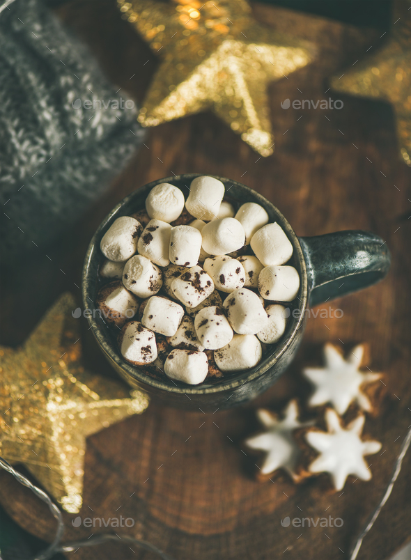 Christmas winter hot chocolate with marshmellows served with light garland - Stock Photo - Images