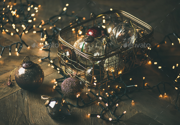 Christmas tree toy decoration balls in box and light garland - Stock Photo - Images