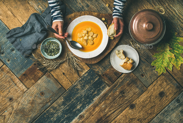 Fall warming pumpkin cream soup, copy space - Stock Photo - Images