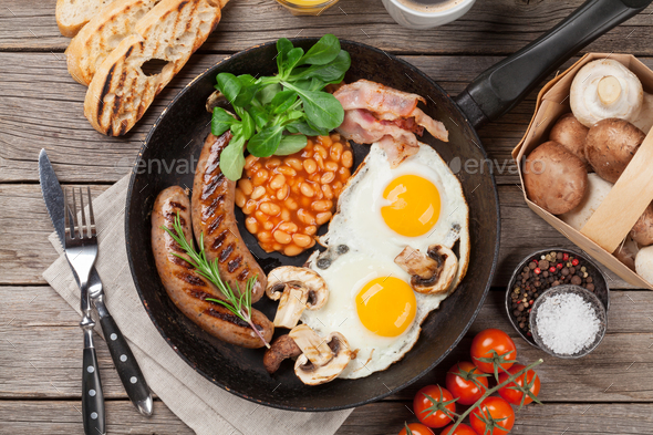 English breakfast. Fried eggs, sausages, bacon - Stock Photo - Images