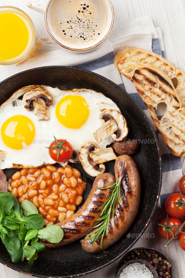English breakfast. Fried eggs, sausages, bacon - Stock Photo - Images