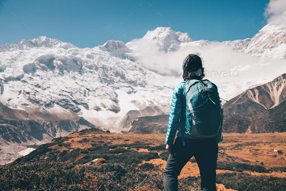 Woman on the stone and mountain valley - Stock Photo - Images