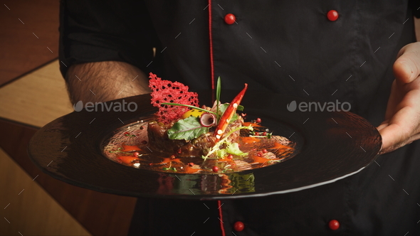 Modern restaurant dish. Veal tartare with quail egg - Stock Photo - Images