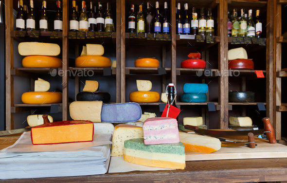 Grocery shop interior. Shelves and counter with cheese - Stock Photo - Images