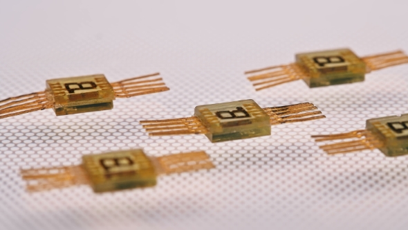 the Technician Takes a Pair of Tweezers Right Led Chip Shot alt