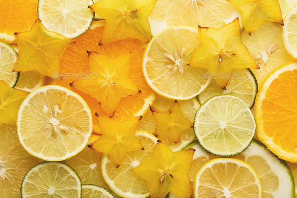 Backlit citrus fruits slices background - Stock Photo - Images