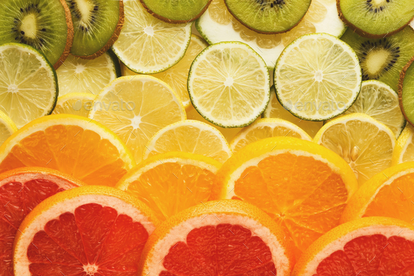 Rainbow background with exotic fruits - Stock Photo - Images