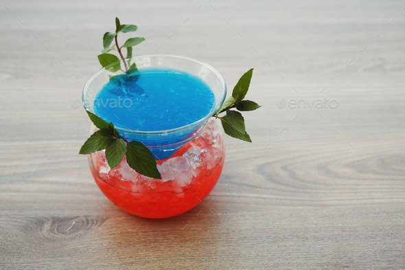 Blue hawaii cocktail served on restaurant table - Stock Photo - Images