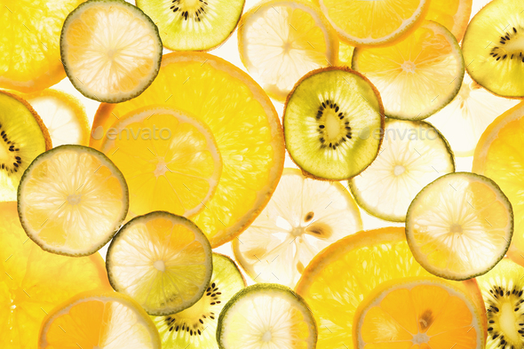 Backlit citrus fruits slices background - Stock Photo - Images