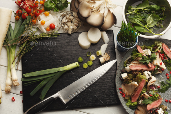 Warm mix salad with duck meat and mushrooms. Modern restaurant dish - Stock Photo - Images