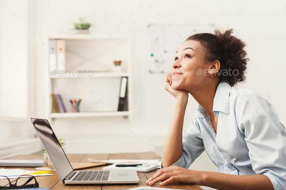 Happy business woman working on laptop at office Stock Photo by Milkosx