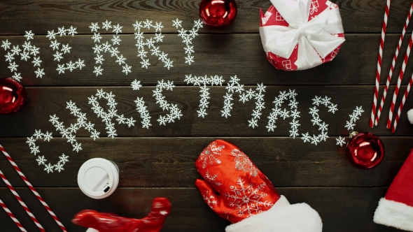 Santa Claus Drinks Tea By Christmas Wooden Holiday Table, Top Down Shot