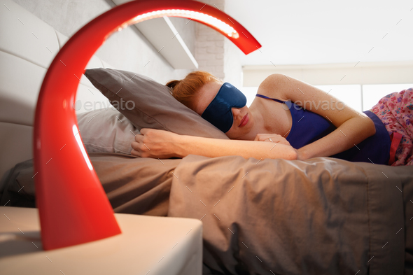 Woman In Bed Sleeping With Sleep Mask On Eyes - Stock Photo - Images