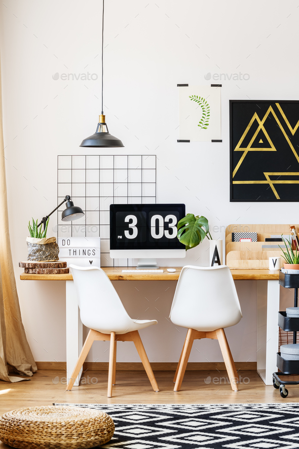 Designer chairs and wooden desk - Stock Photo - Images