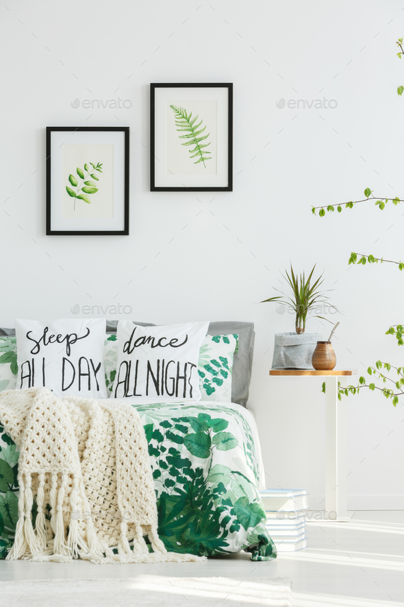 Bed with beige knit blanket - Stock Photo - Images