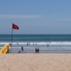 Kuta Beach, Bali, Indonesia. Surf Rescue Point. Yellow Rescue Surfboard and Red Flag - VideoHive Item for Sale