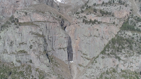 Aerial Flight with Drone in Front of Waterfall