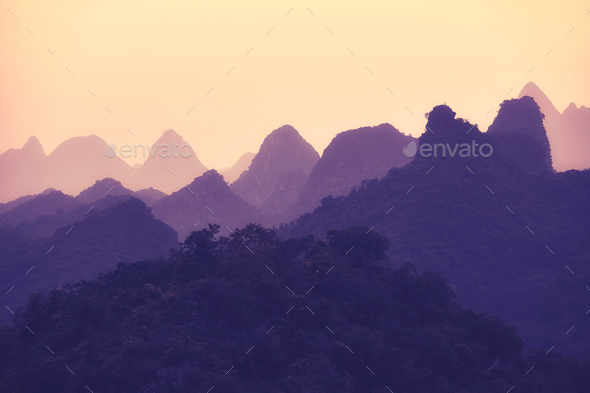 Scenic sunset over Karst mountains formations in Guilin, China. - Stock Photo - Images