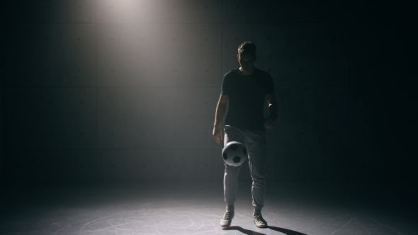 Young Man Practicing with Soccer Ball alt