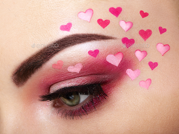 Eye make-up girl with a heart - Stock Photo - Images