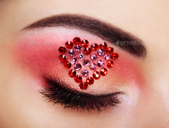 Eye make-up girl with a heart - Stock Photo - Images