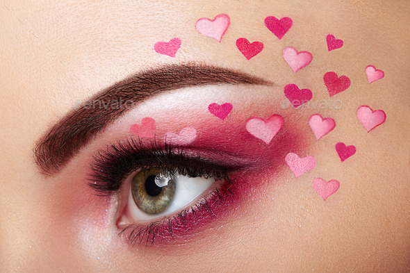 Eye make-up girl with a heart - Stock Photo - Images