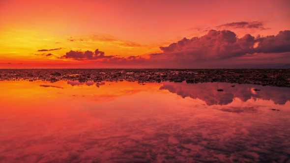 Beautiful Sunset and Clouds Reflection in Sea at the Island Nusa Lembongan, Indonesia alt