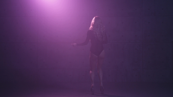 Seductive Blonde Performing an Erotic Dance