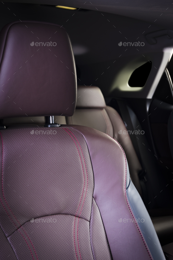Black perforated leather back seats in modern luxury car Stock Photo by  gargantiopa