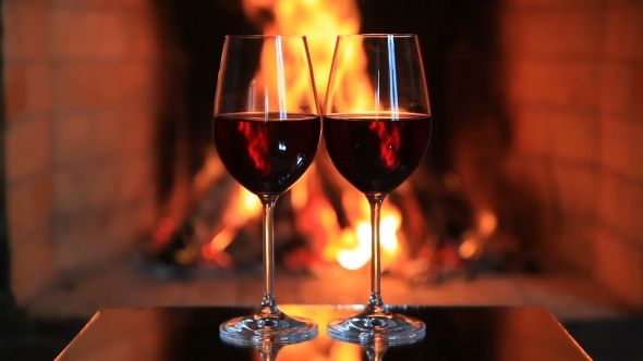 Two Glasses Of Red Wine Near A Fireplace By Antonpetrus Videohive