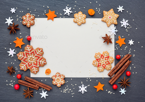 Christmas background with gingerbread cookies, snowflakes, spice - Stock Photo - Images