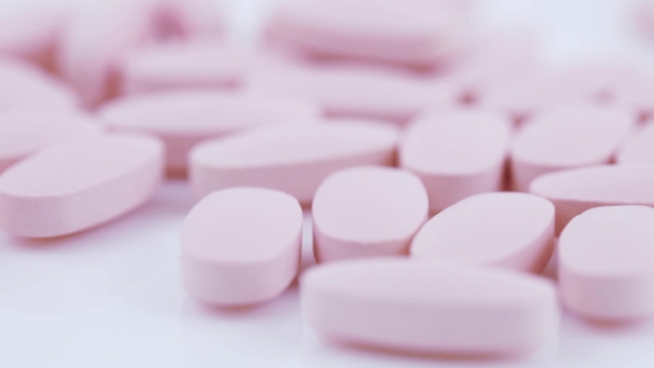 Oval Pink Tablets on Plate