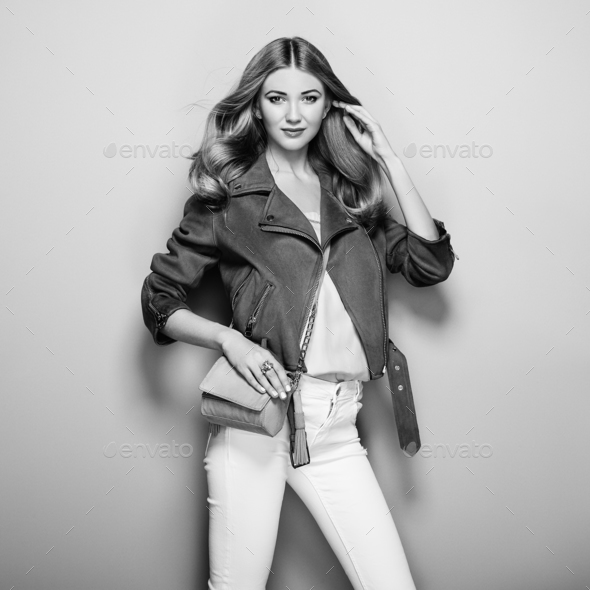 Black and white photo of young woman in leather jacket - Stock Photo - Images