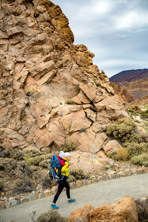 Mother with baby boy hiking in backpack - Stock Photo - Images