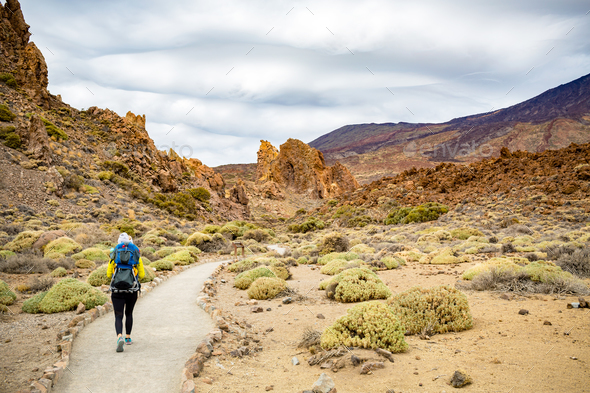 Mother with baby boy hiking in backpack - Stock Photo - Images
