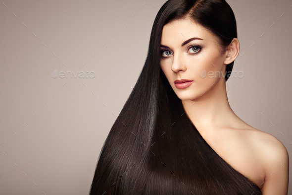 Beautiful woman with long smooth hair - Stock Photo - Images