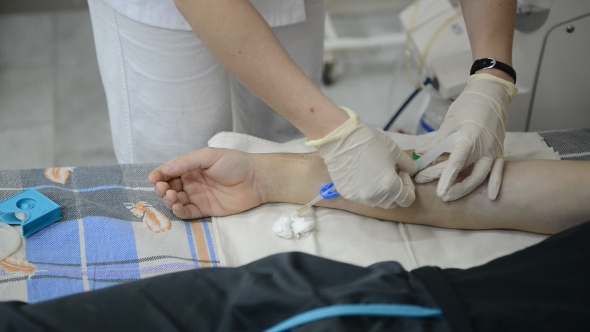Nurse Prepares Patient's Arm for Dialysis