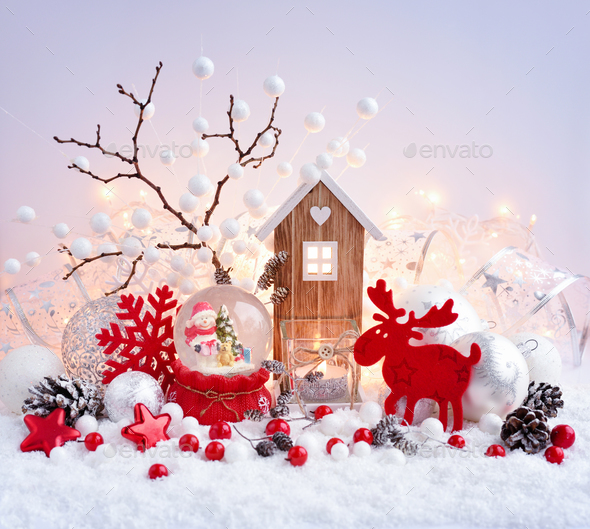 A snow globe with snowman with christmas decorations and toy hou - Stock Photo - Images