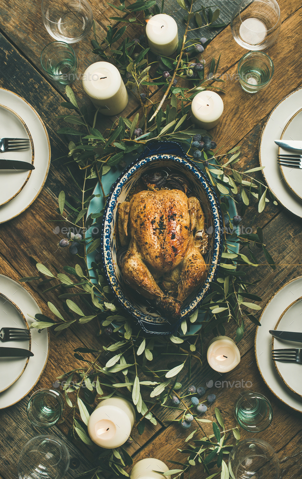 Flat-lay of whole roasted chicken for Christmas over table background - Stock Photo - Images