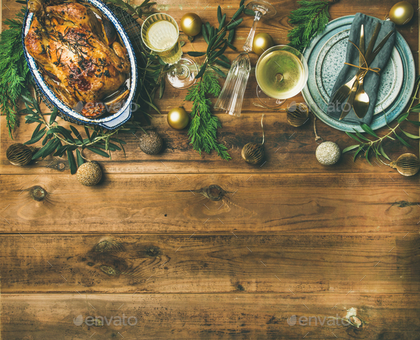 Christmas or New Year celebration table setting over wooden background - Stock Photo - Images