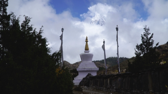 Buddhist Stupa and Snow Mountain alt