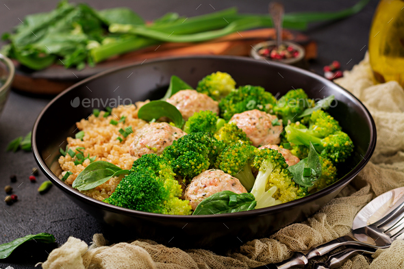 Baked meatballs of chicken fillet with garnish with quinoa and boiled broccoli. - Stock Photo - Images